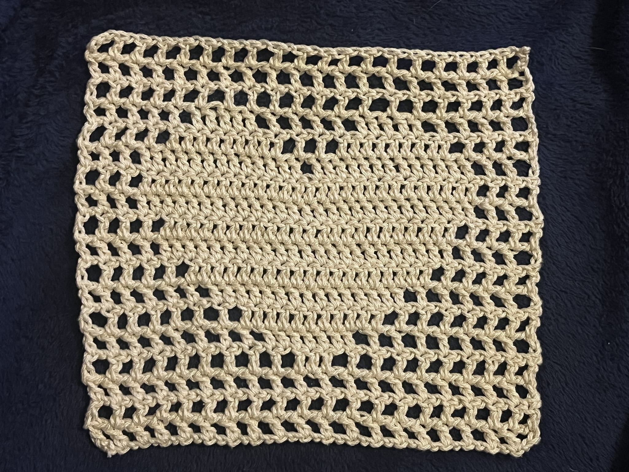 square of filet crochet with solid heart shape in center